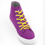 Photo of a single hi-top, purple shoe with a Sliwil neon yellow shoelace in it.