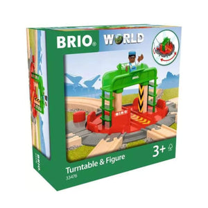Photo of the BRIO Turntable and Figure box. The box shows the plastic turntable with its grey and red base and green gantry. It shows track coming off the turntable in seven directions. A BRIO figure stands at the top of the gantry. The box shows that it is suitable for ages 3+.