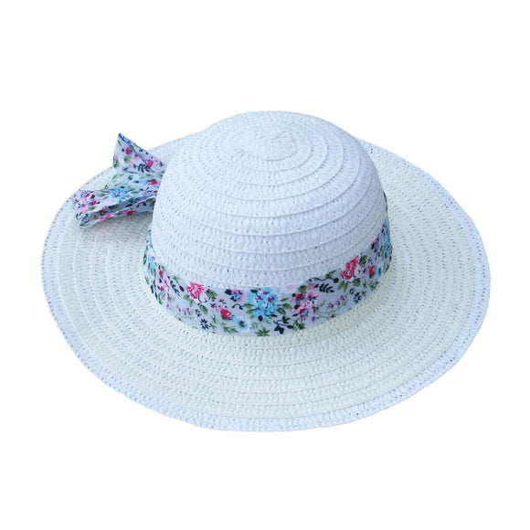 Photo of a cream paper straw child's summer hat. It has a pretty floral ribbon and bow around it.