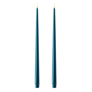 Photo of 2 petroleum (teal blue) 38cm tapered dinner candles. Their led flames are lit and they have black wicks.