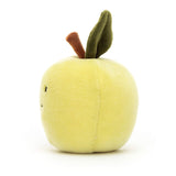 Side view photo of a Jellycat green apple cuddly toy. It has black eyes and smiling mouth, a dark brown stalk and dark green leaf can be seen on top.