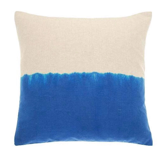 Image showing the 43x43cm Lido Blue Cushion. The linen chambray base fabric has been dipped on one side in a azure blue for half of it. This create a cushion that has a slight ombre and jagged effect in the middle as it goes from blue to linen.