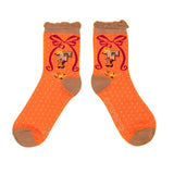 Tangerine ankle socks with taupe toes, heel and frill. The letter F is on the ankle with a bow  illustrated around it.