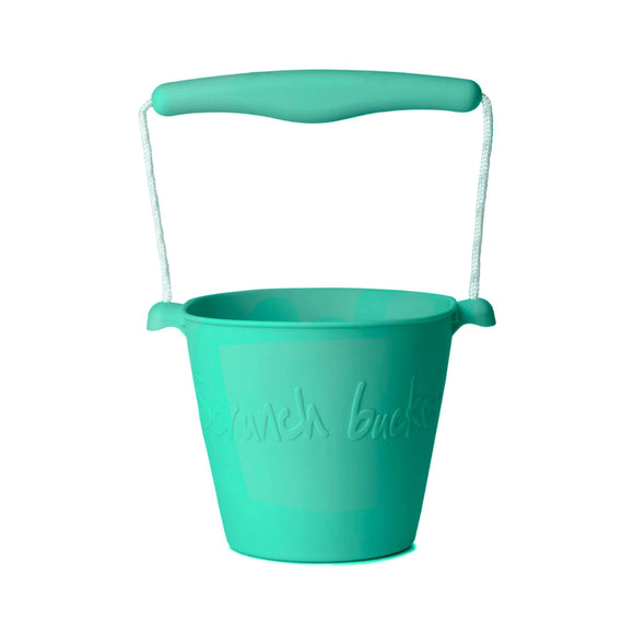 Photo of the Scrunch Bucket in Teal Green. Its handle is made from a matching central piece of plastic and teal green and white rope.