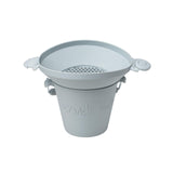 Photo of a pale grey Scrunch Panner sitting on top of a Scrunch Bucket. The photo is to show that they are designed to work perfectly together.