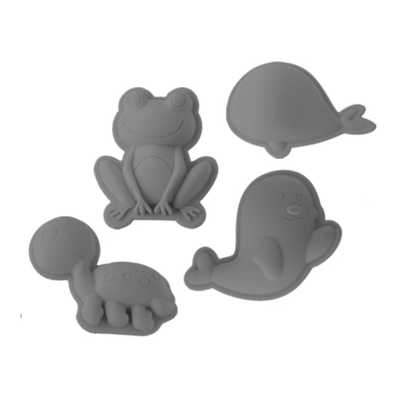 Photo of four grey silicone moulds for sand and soil from Scrunch. The four shapes are a frog, whale, seal and turtle.